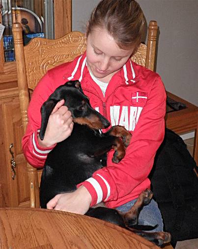 Tanya cuddles her Dachshund Gilly